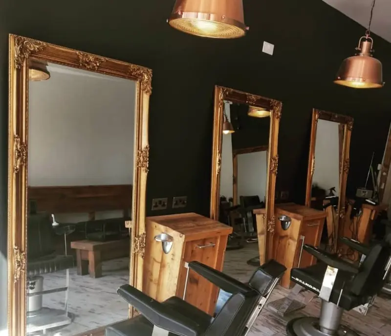 Barber chairs and mirrors inside Moustache Barbers in Meanwood
